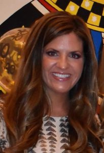 Photo of Beth Battista smiling at the camera.