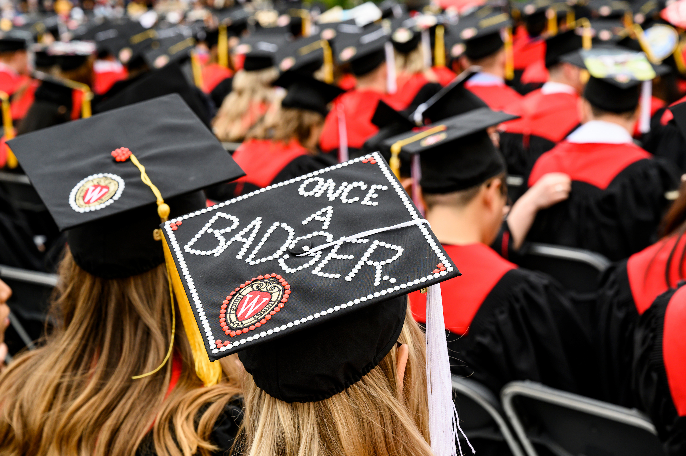 Graduate cap that reads "Once a Badger"